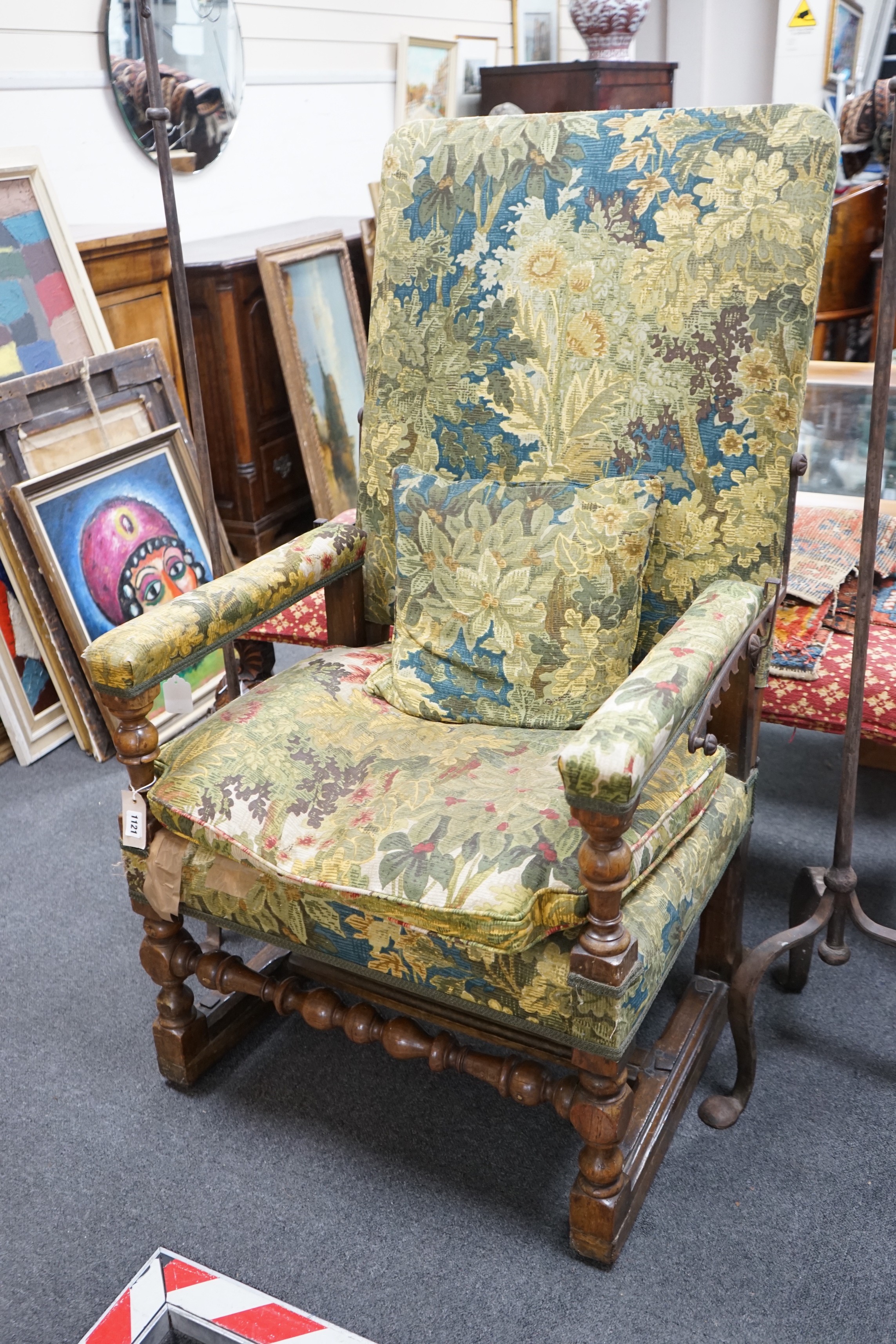 A 19th century French carved walnut reclining armchair, width 74cm, depth 59cm, height 120cm